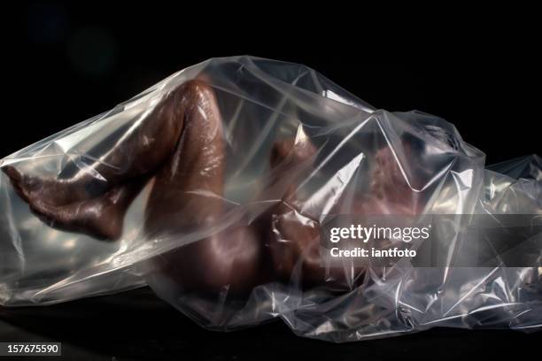 man wrapped in plastic film. - man wrapped in plastic stock pictures, royalty-free photos & images