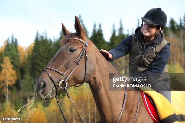 girl horseback riding in the forest, norway - horse grazing stock pictures, royalty-free photos & images