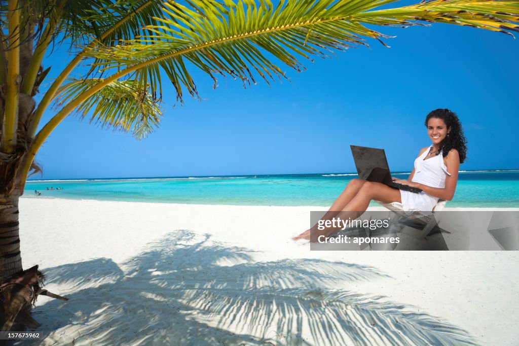 Young woman using laptop in the perfect place to work
