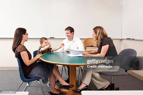 parent and teacher conference in a classroom - teacher meeting stock pictures, royalty-free photos & images