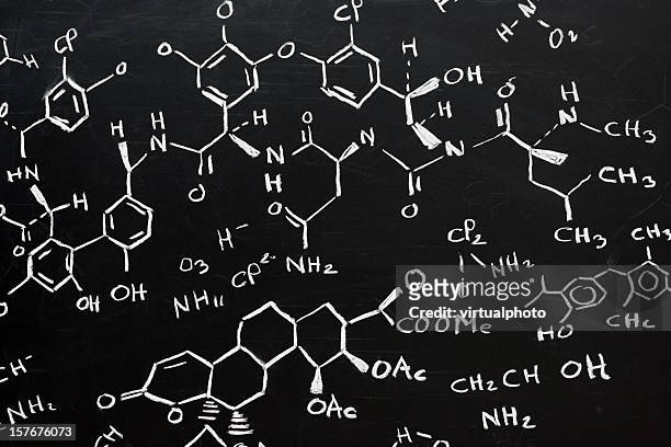 chemical formula written stylishly on a black background - chemical formula stock pictures, royalty-free photos & images