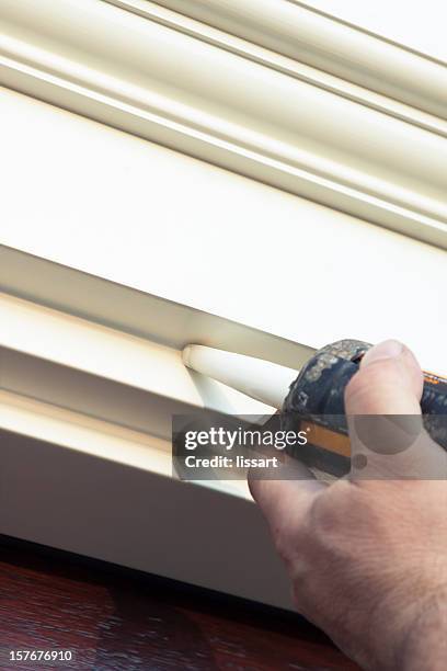 applying caulk - caulk gun stock pictures, royalty-free photos & images