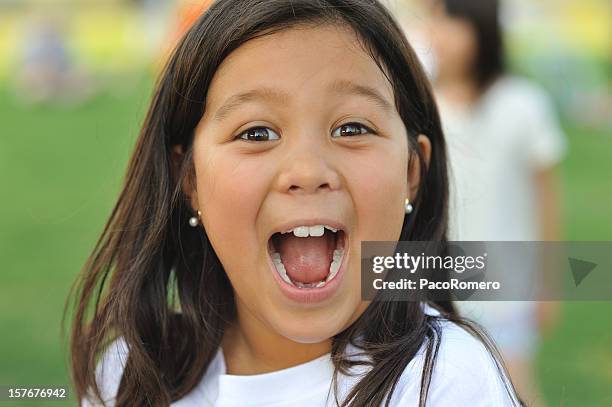 little girl with mouth open and happy expression - girl open mouth stockfoto's en -beelden