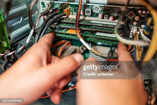 Technician Installing RAM Component In A Workshop Technician Installing RAM Component In A Workshop