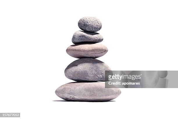 stack of volcanic pebbles isotaded on white with clipping path - zen stock pictures, royalty-free photos & images