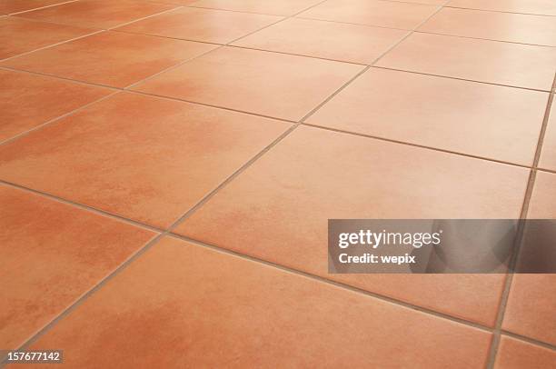 terracotta floor tiles clean background diminishing perspective - tiled floor stock pictures, royalty-free photos & images
