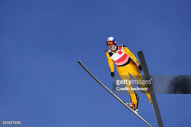 ski jumper gegen den blauen himmel - ski jumping day 1 stock-fotos und bilder