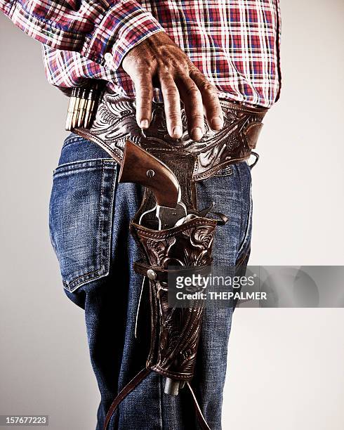 american cownboy going for his gun - holster stock pictures, royalty-free photos & images
