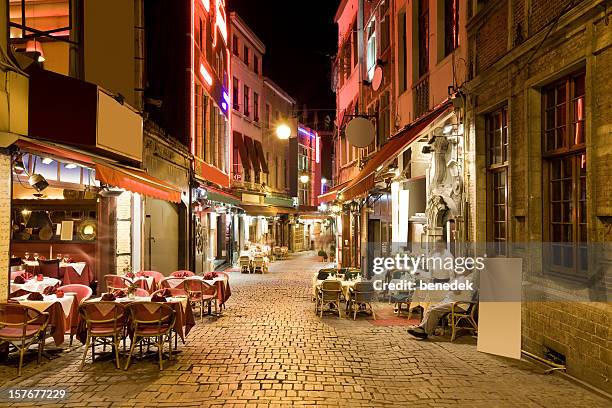 restaurant alley in brussels, belgium - patio restaurant stock pictures, royalty-free photos & images