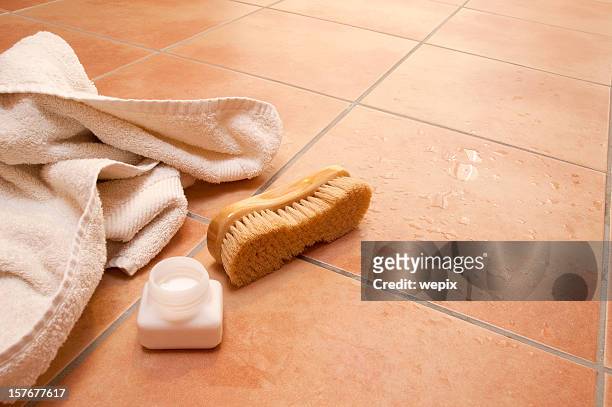 wellness towel brush bath salts wet terracotta tile floor - small group of objects stock pictures, royalty-free photos & images
