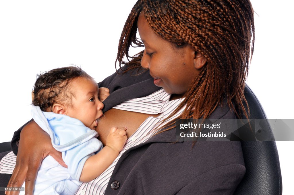 African American Business Woman Looking at her Baby While Breastfeeding