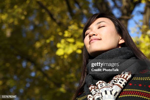 young woman close eyes and deep breathing - xxxlarge - woman smiling eyes closed stock pictures, royalty-free photos & images