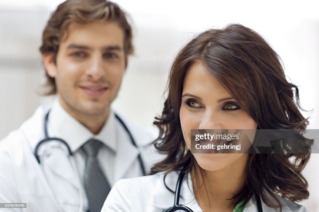 Young doctor with colleague in the background