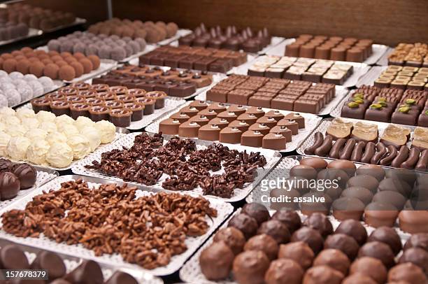 chocolate pralines in a swiss confiserie - chocolate stock pictures, royalty-free photos & images