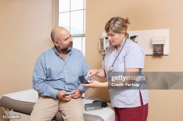 nurse explaining the use of diabetic equipment - dialysis stock pictures, royalty-free photos & images