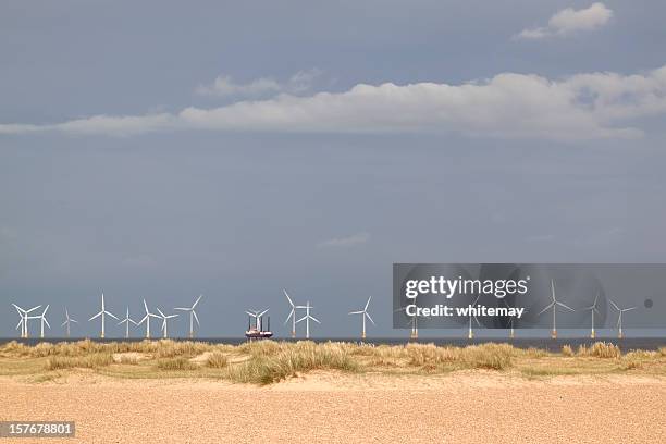 off-shore wind farm with jack-up maintenance barge - oil rig uk stock pictures, royalty-free photos & images