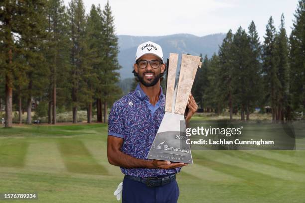 Akshay Bhatia of the United States poses with the trophy after winning after the final round of the Barracuda Championship at Tahoe Mountain Club on...