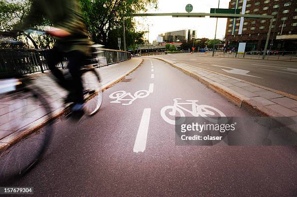 young adult on bike in the city - cykelbana bildbanksfoton och bilder