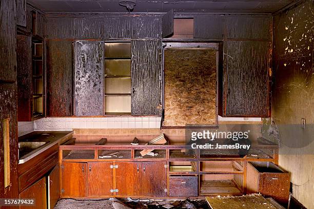 aftermath: charred remains of kitchen destroyed by fire - damaged stock pictures, royalty-free photos & images