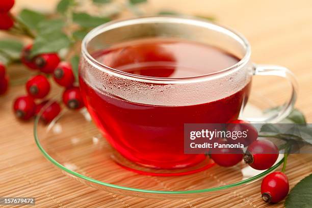cup of rose hip tea - rose hip stock pictures, royalty-free photos & images