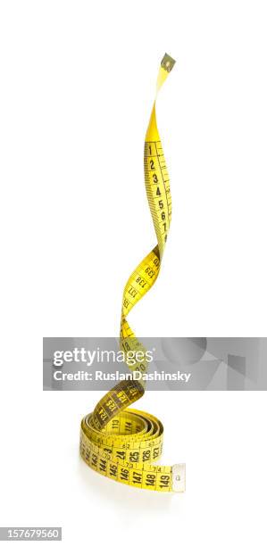 falling down amarillo cinta métrica. - metro unidad de medida fotografías e imágenes de stock