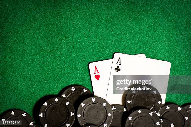poker table with black gambling chips and aces - poker wallpaper stock pictures, royalty-free photos & images