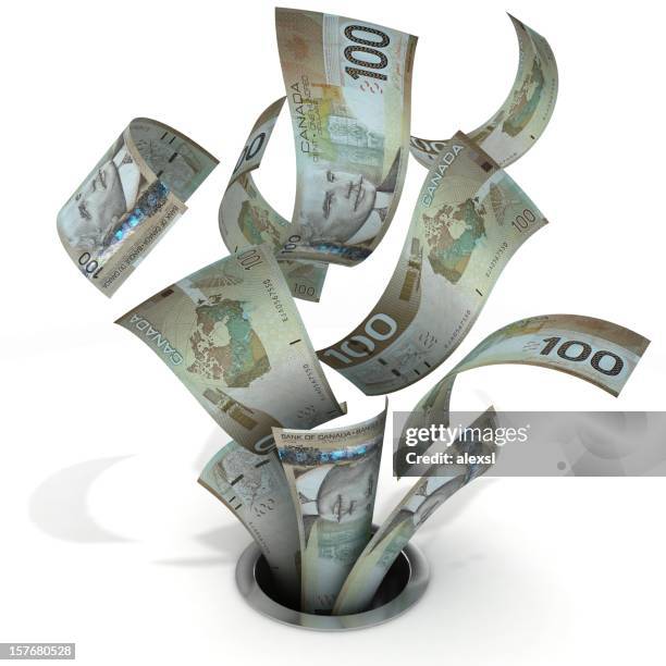 money down the drain-kanadische dollar - canadian currency stock-fotos und bilder