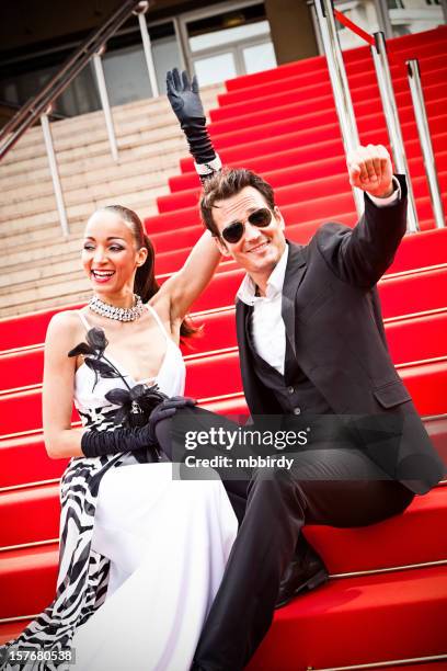 celebrity couple on red carpet in cannes - cannes film festival red carpet stock pictures, royalty-free photos & images