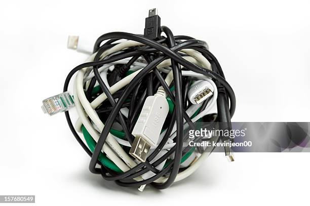 a ball of tangled cable wires on a white background - wire balls stock pictures, royalty-free photos & images
