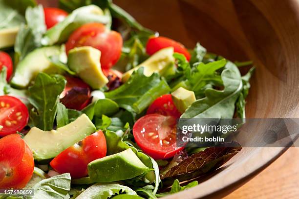 fresh salad with cherry tomatoes, avocado and mixed greens - grönsallad bildbanksfoton och bilder