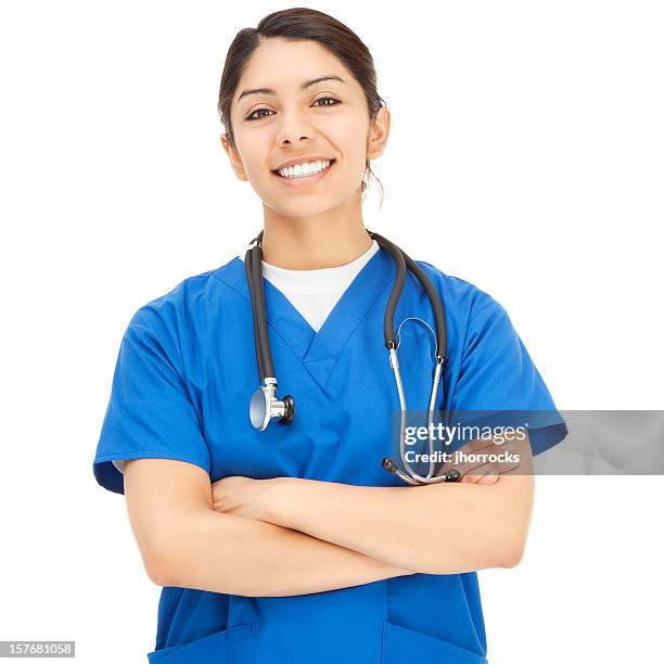 cheerful young hispanic nurse in blue scrubs - doctor white background stock pictures, royalty-free photos & images