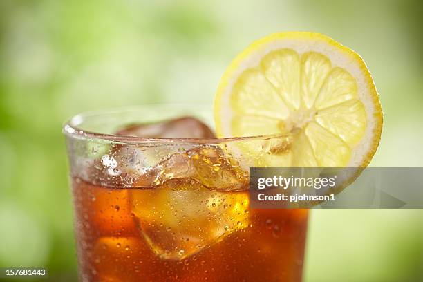 a close-up of a glass of iced tea with lemon - lemon soda stock pictures, royalty-free photos & images