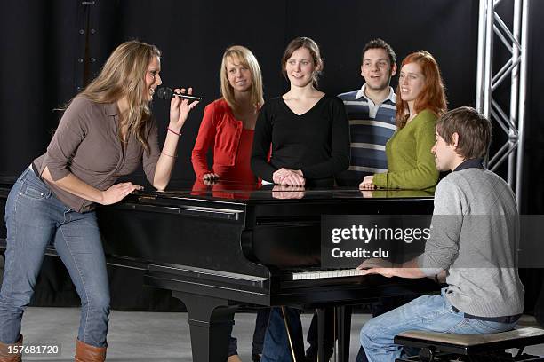 female singer, chorus, pianist and grand piano - choir stage stock pictures, royalty-free photos & images