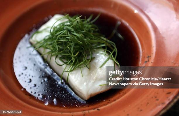 Halibut dish is served at Main Kitchen on Wednesday, Oct. 8 in Houston.