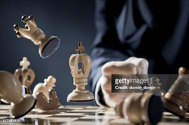 pissed off chess player is punching in the chessboard - rook chess piece stock pictures, royalty-free photos & images