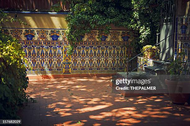 traditional patio in seville - seville tiles stock pictures, royalty-free photos & images