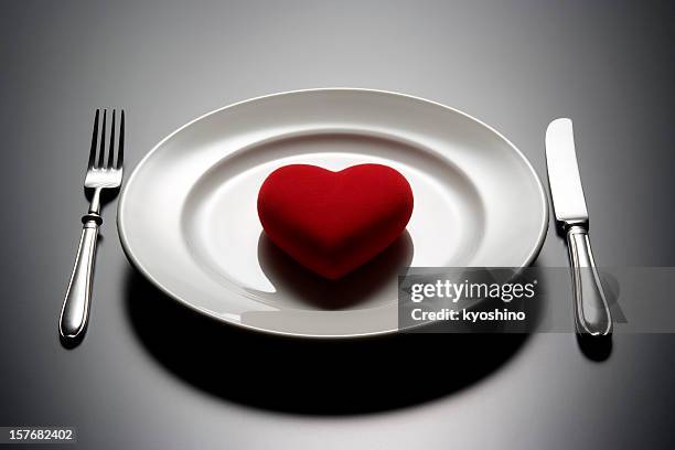 red heart shape with white plate on black table - valentines day dinner bildbanksfoton och bilder