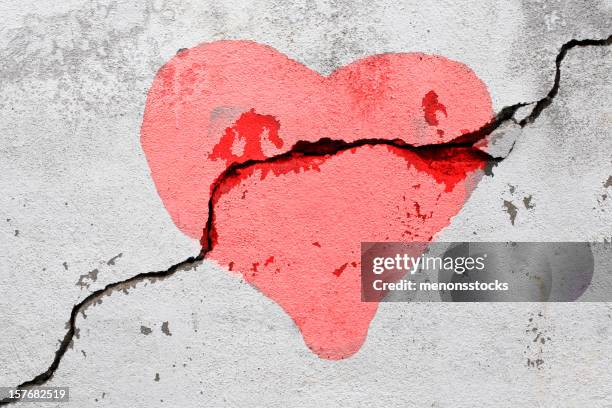 broken heart - crevice stock pictures, royalty-free photos & images