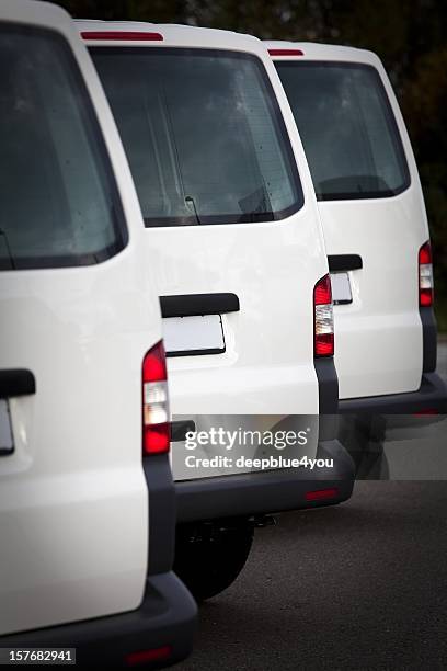 white transporters in a row - car fleet stock pictures, royalty-free photos & images