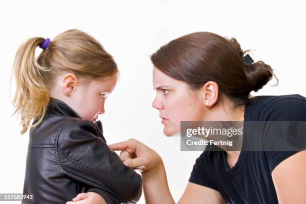 mother scolding her daughter - mother scolding stock pictures, royalty-free photos & images