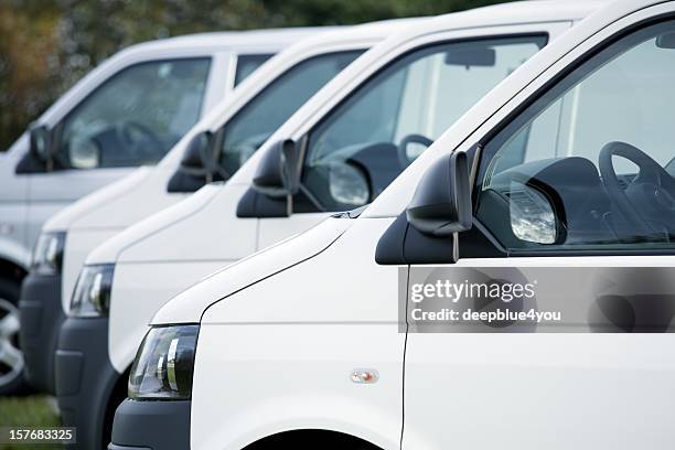 white vans in a row - delivery truck stock pictures, royalty-free photos & images