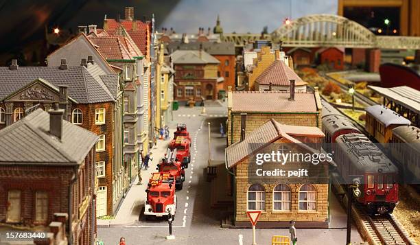 model railroad layout with fire engines - miniature train stock pictures, royalty-free photos & images