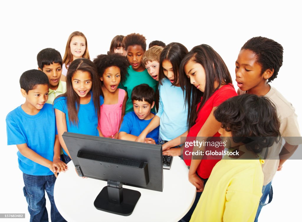 Watching Over Computer Surprised Multi Ethnic Kids Watching Computer Monitor Over White ...
