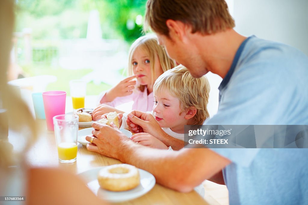 Family having their breakfast together