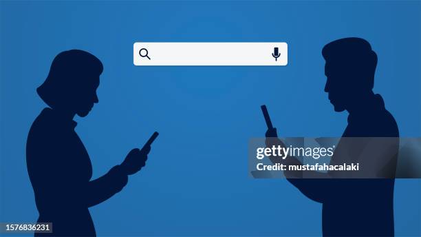 woman and man silhouettes search the internet using a smartphone - man searching stock illustrations