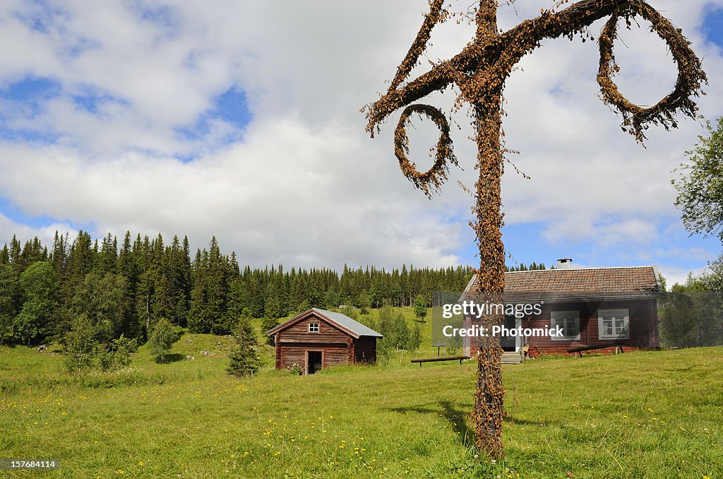 Beautiful cottage and barn with maypole in northern Sweden