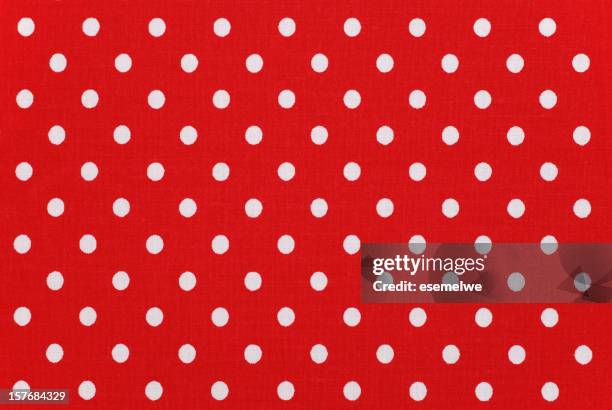 white polka dots on red fabric - red polka dot stock pictures, royalty-free photos & images