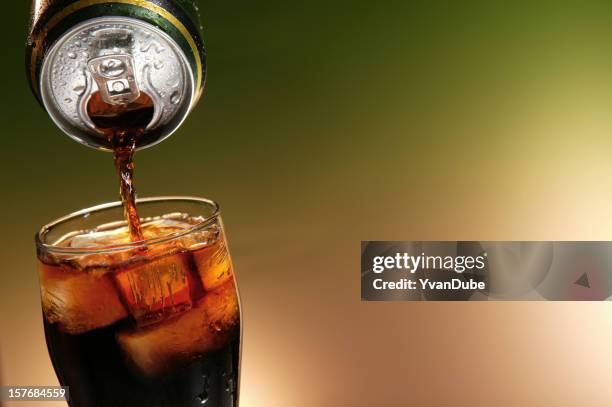 cola can pouring in a glass - cola stock pictures, royalty-free photos & images