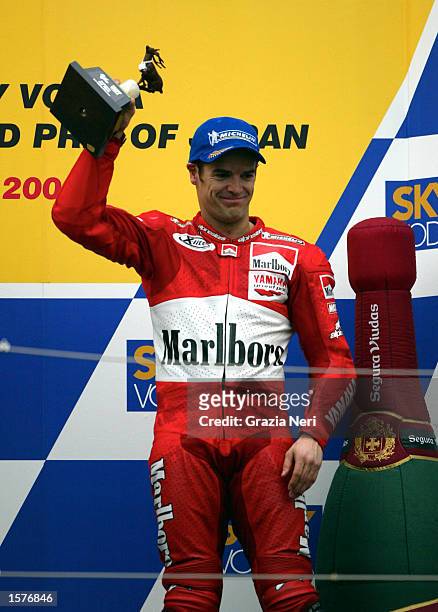 Apr 2002 . Carlos Checa of the Marlboro Yamaha team 3rd on the podium after the first round of the 500cc Motor cycle championship held at the Suzuka...