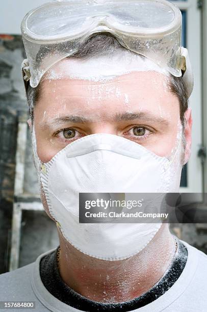 close up portrait of a construction worker wearing protective mask - dirty construction worker stock pictures, royalty-free photos & images